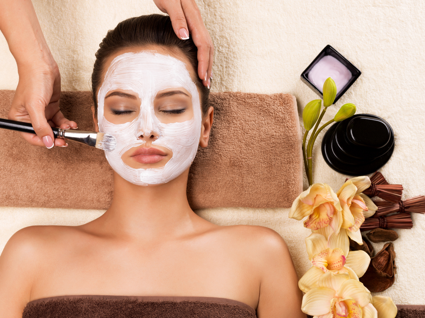 Woman Having a Facial Cosmetic Mask at Spa Salon